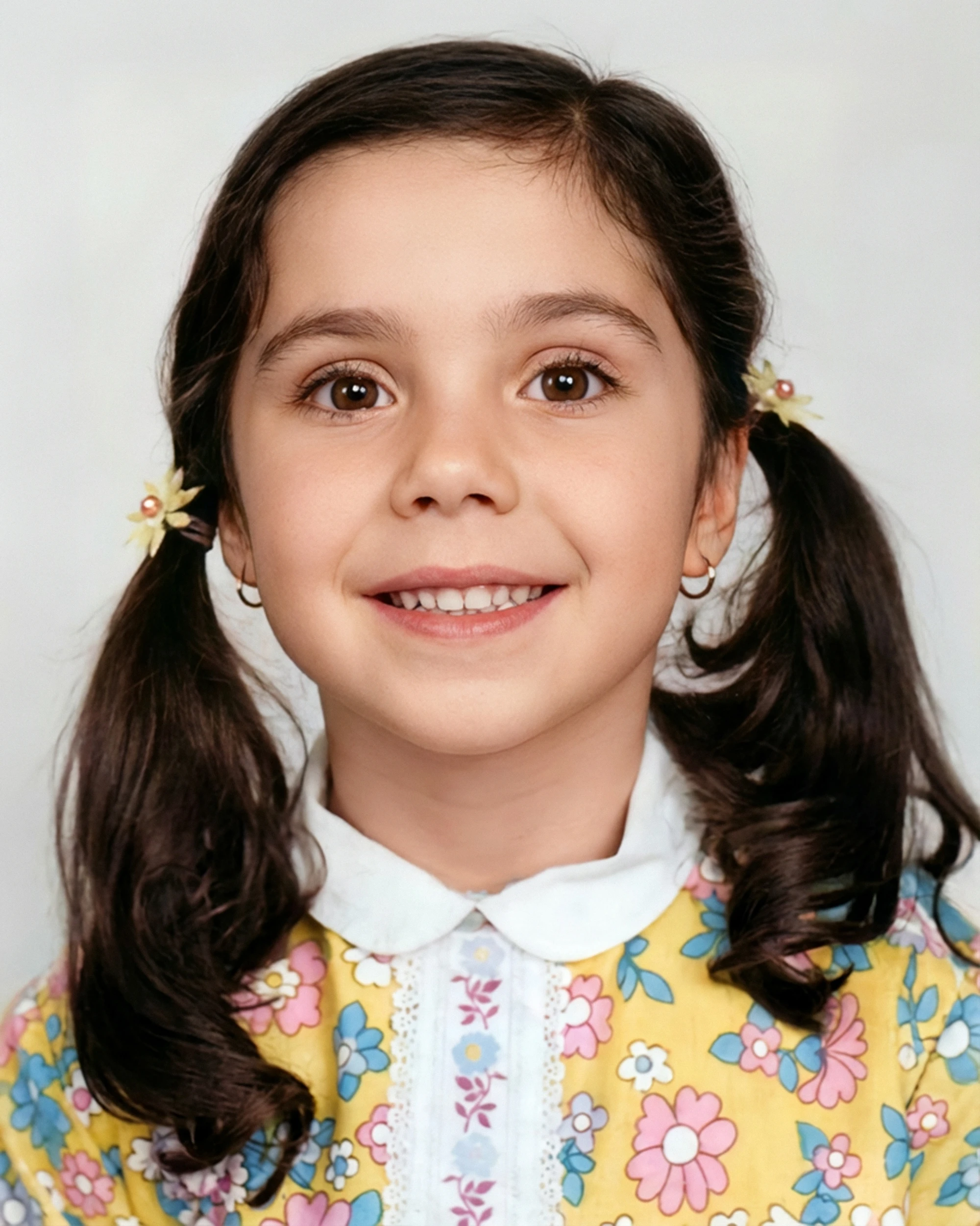Restored childhood photo of a young girl with cracks and color fixed